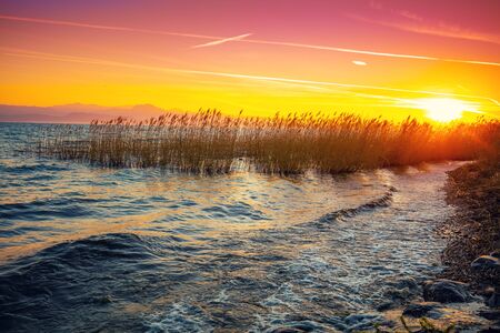 Early morning, sunrise over the lake.  Garda lake (Lago di Garda), Italy, Europeの写真素材