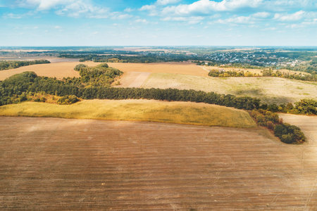 Summer rural landscape. aerial view. View of plowed fields with beautiful sky