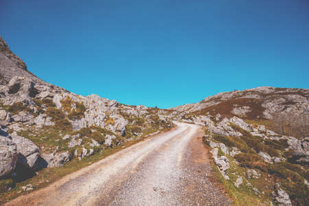 Car driving on a mountain winding road. The road from glacial lake Enol to lake Ercina. National Park Peaks of Europe (Picos de Europa). Asturias, Spain, Europeの写真素材