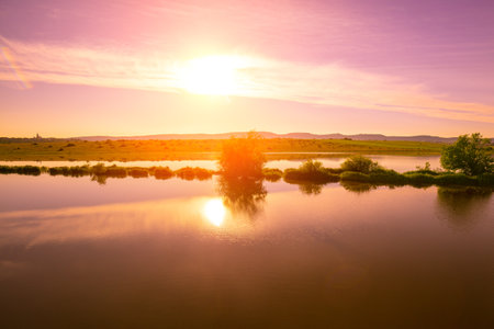 Magical sunset over the lake. Serene lake in the evening. Nature landscape.の写真素材