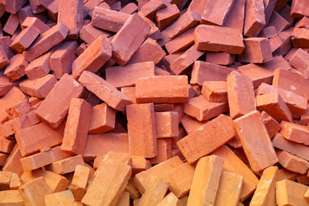 Clay handmade bricks. Abstract pile of bricks backgroundの写真素材