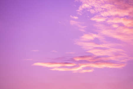 Pink cloudy sky at sunset. Sky texture, abstract nature backgroundの写真素材