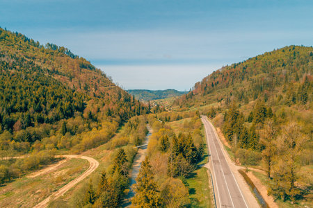 Aerial view of the mountain highway in spring. Beautiful mountain landscape. Carpathian mountains. Ukraineの写真素材