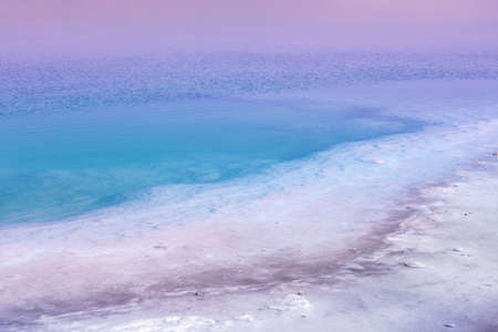Dead sea in the early morning. Wild nature. Tropical minimalist landscape. Sunrise over the sea. Gradient color. Summertime.の写真素材