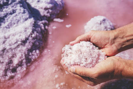Pink Dead Lake salt in male handsの写真素材