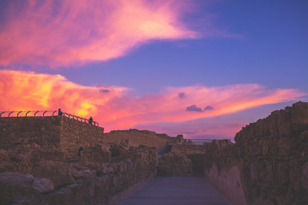 Beautiful purple sunrise over Masada fortress. Ruins of King Herod's palace in the Judaean Desert....