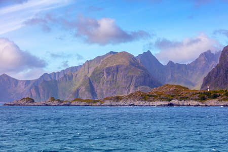 Open sea. View of the rocky seashore. Lighthouse on the shore. Beautiful nature of Northern Norway. Lofoten islandsの素材 [FY310174209310]