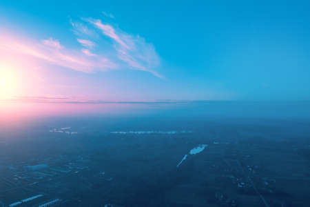 Rural landscape in the morning with the blue-pink sky. Aerial view of the countryside during sunriseの写真素材