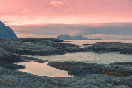 Rocky seashore with cloudy sky. Wilderness. Beautiful nature of Norway. Lofoten islands