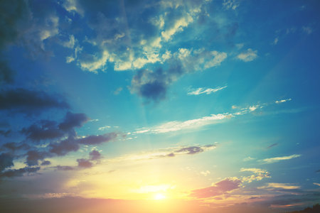 Blue cloudy sky at sunset. Sky texture. Abstract nature background
