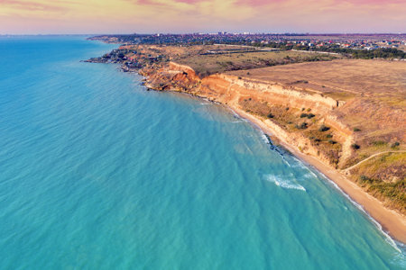 Seascape with sea and city on the clay steep coast. Aerial view towards Fontanka, Odesa, Ukraineの写真素材