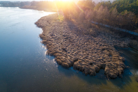 Sunset over the lake. Serene lake in the evening. Nature landscape. Aerial view
