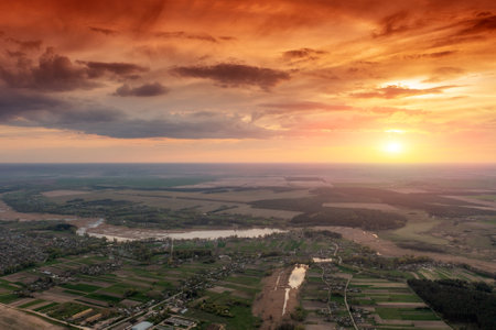 Magical pink sunset over the countryside. Serene lake in the evening. Nature landscapeの写真素材