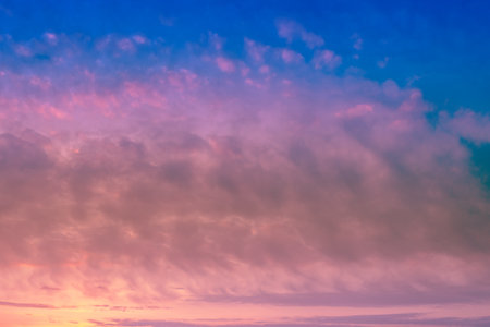 Colorful cloudy sky at sunset. Gradient color. Sky texture, abstract nature backgroundの写真素材