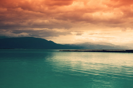 Seascape in dramatic light. The Dead Sea during sunset. Unique sea in the world. Israel