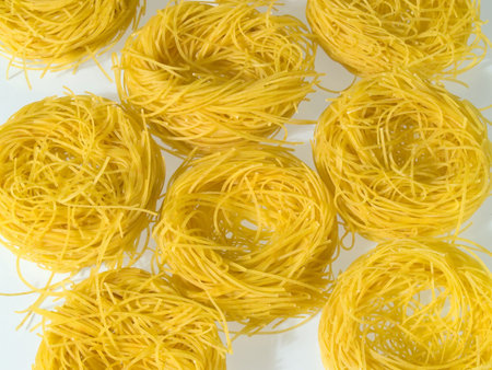 Noodle nests for soup, white backgroundの写真素材