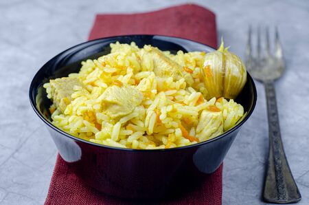 Uzbek pilaf on the wooden plateの写真素材