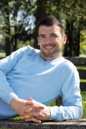 happy man on a benchの写真素材