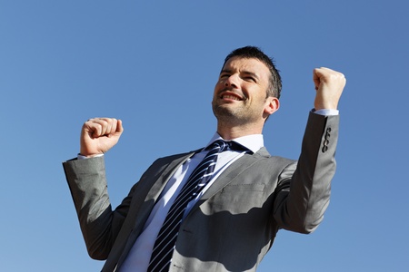 young businessman and blue sky in summerの写真素材