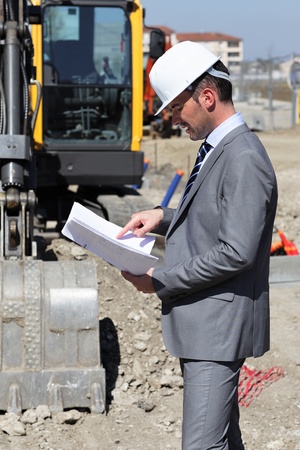 young man with hardhat on building siteの写真素材