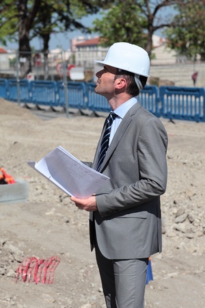 young architecte with hardhat in building siteの写真素材