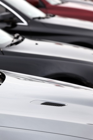 lot of sport cars in a garage for saleの写真素材