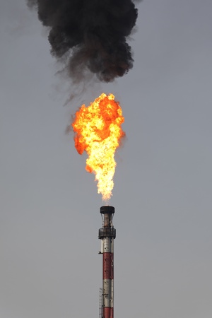 fire of refinery industry with black smokeの写真素材