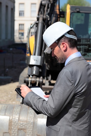 young man with hardhat on building siteの写真素材