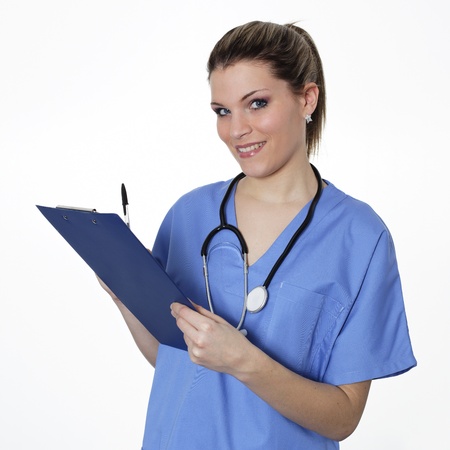 woman doctor with pen and stethoscope in studioの写真素材