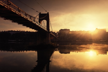 sunset and footbridge in Lyon city in France の写真素材