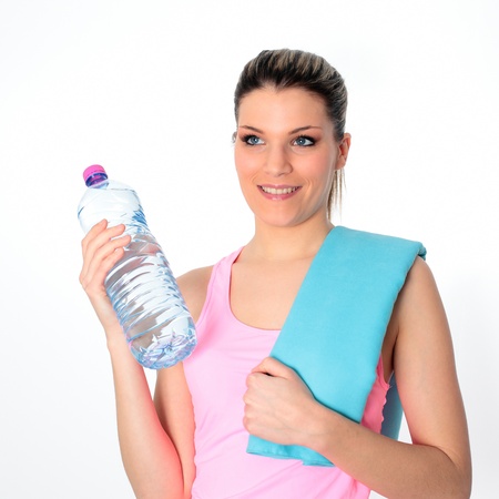 young woman holding a bottle of waterの写真素材