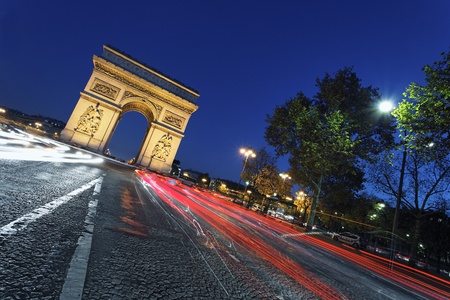 the "Arc de Triomphe" by night, Paris France の写真素材