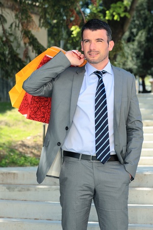 businessman with bags outdoor before christmasの写真素材