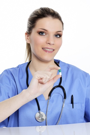woman doctor with pill in the handの写真素材