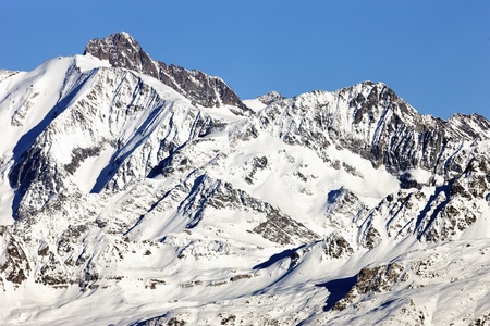 french alpine mountain with snow in winterの写真素材