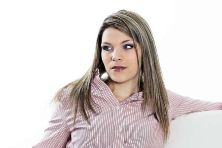 beautiful pensive woman alone on sofa at homrの写真素材