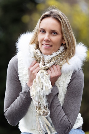 portrait of blond woman outdoor in autumnの写真素材
