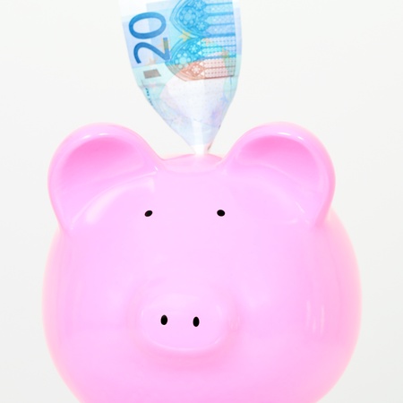 piggy bank with bill isolated on white background の写真素材