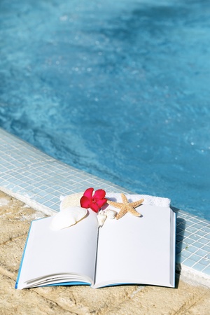 Spa setting with flower and white bookの写真素材