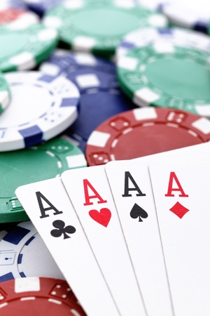 four aces of a kind with chips backgroundのeditorial素材