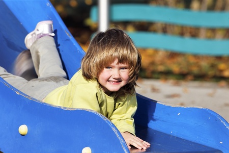 portrait of child playing on colorful playground の写真素材