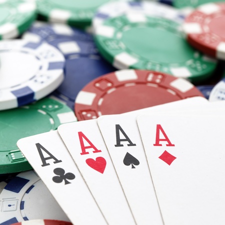 four aces of a kind with chips backgroundのeditorial素材