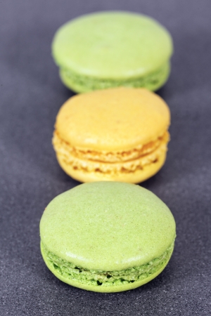 green and yellow macaroons in kitchenの写真素材