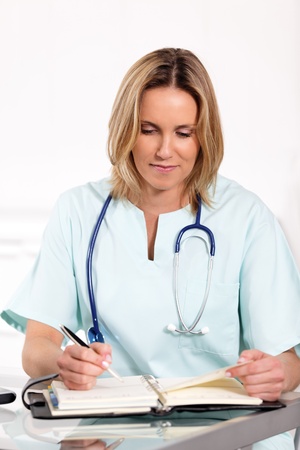 portrait of blond woman doctor in hospitalの写真素材