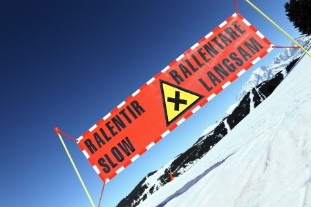 danger panel on ski track on mountainの写真素材