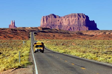 school bus on the road at Monument Valley, USAのeditorial素材