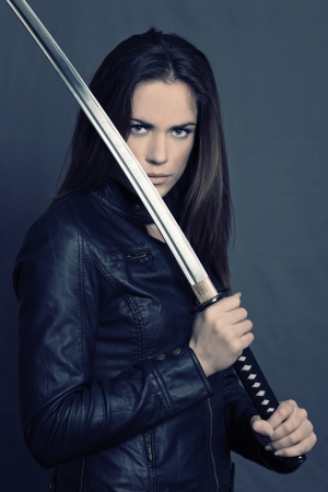 Girl with Katana in studioの写真素材