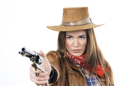 Attractive cowgirl with gun on white backgroundの写真素材
