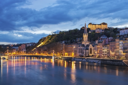 Bridge over river saone at night, Lyon, Franceの写真素材