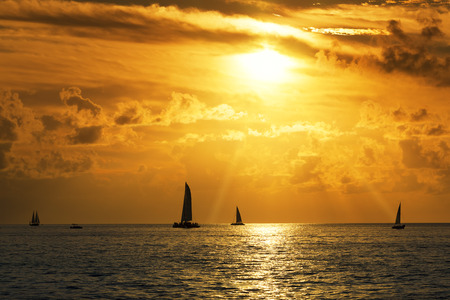 View of Sailboats in the sea at sunset の写真素材